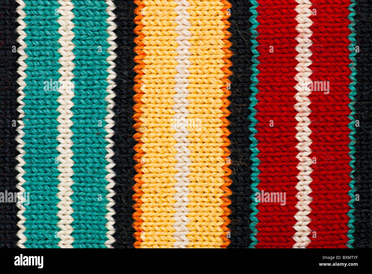 Multicolored knitting background of handmade woolen pattern Stock Photo