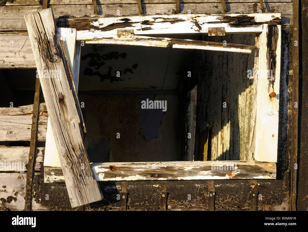 Window and wall of an old derelict wooden hut (shieling) on the isle of Lewis Stock Photo