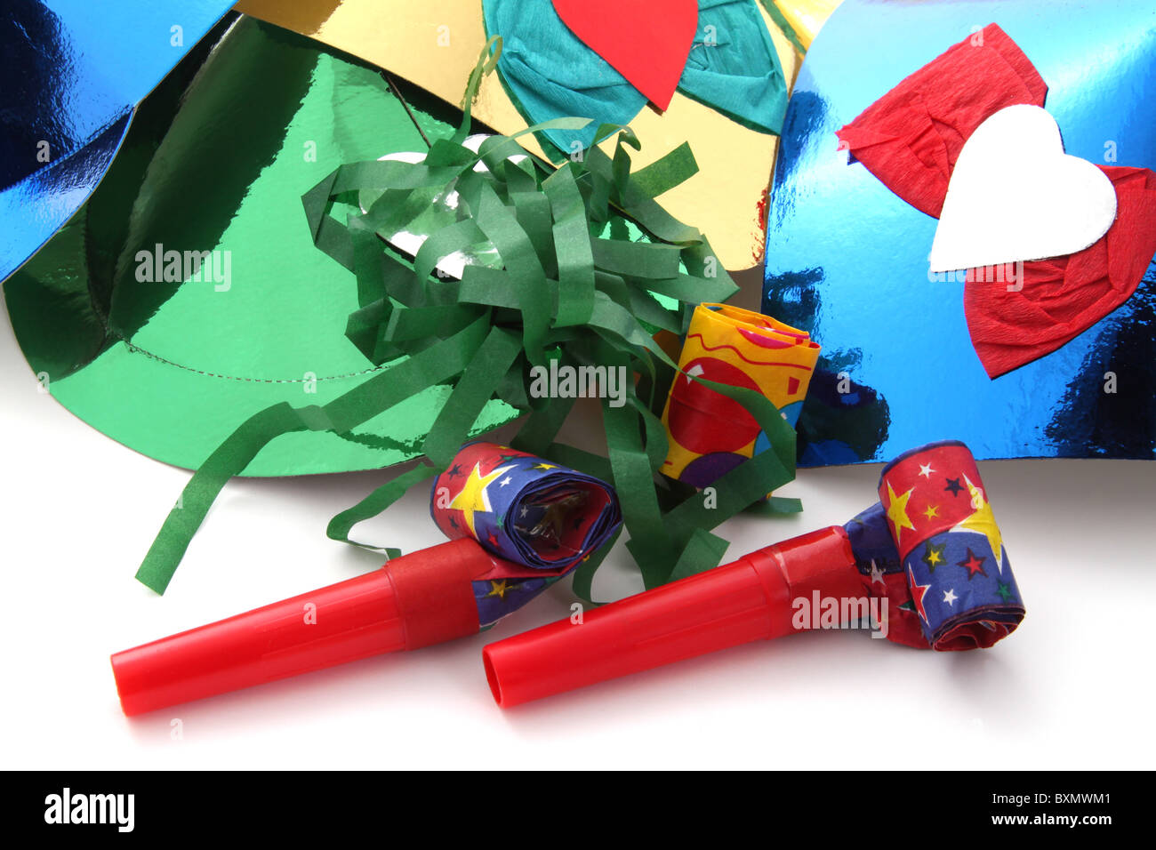 Party hats and party blowers on a plain white background Stock Photo ...