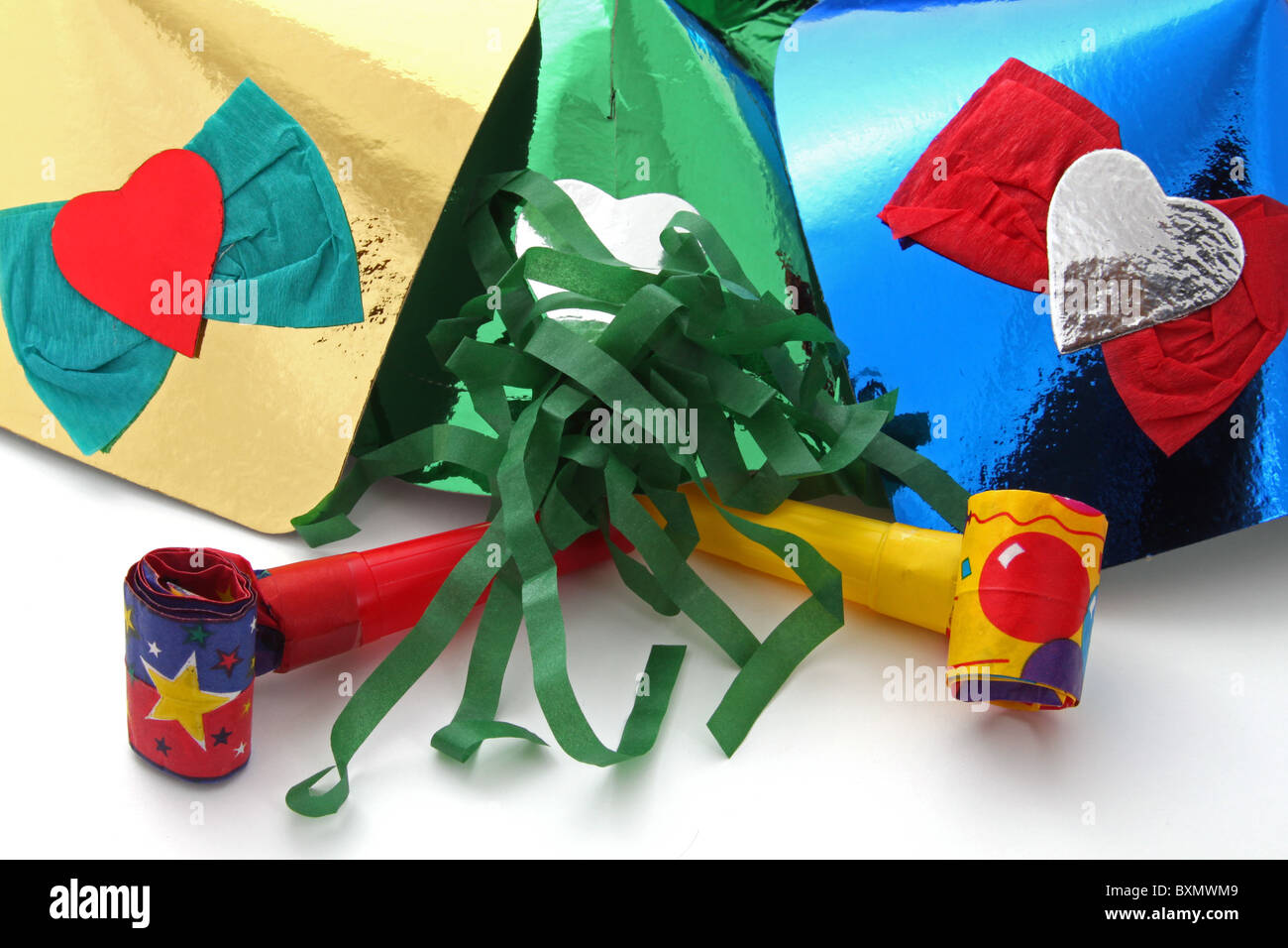 Party hats and party blowers on a plain white background Stock Photo ...