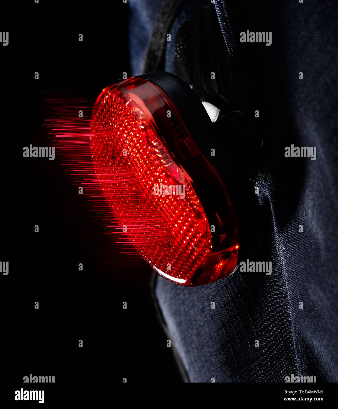 A bag mounted rear bicycle light. Stock Photo