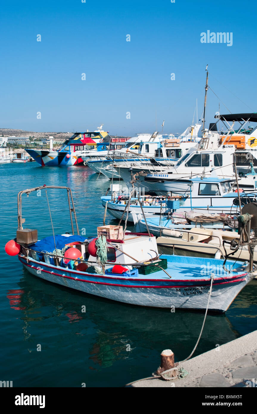Cruise and sailing ships in Agia-Napa harbor, Cyprus, Mediterranean. Fishing dories Stock Photo