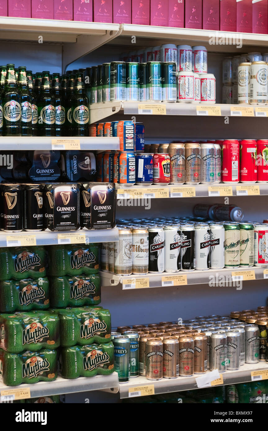 Glass bottles and of aluminum beer cans on shop shelves Stock Photo Alamy