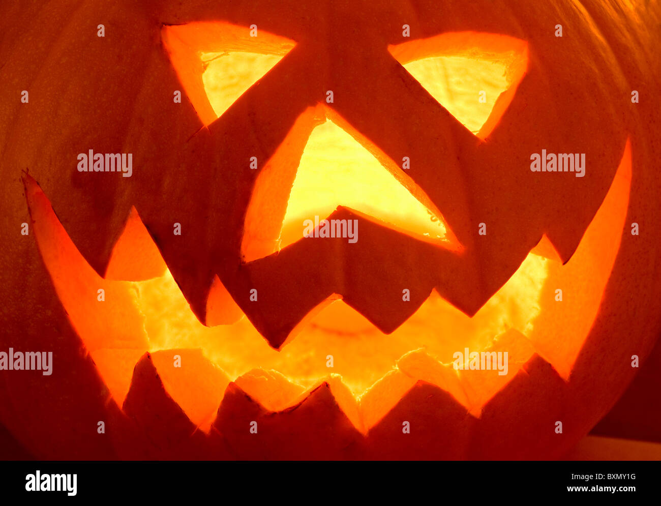 Illuminated Scary Halloween Pumpkin Face Stock Photo