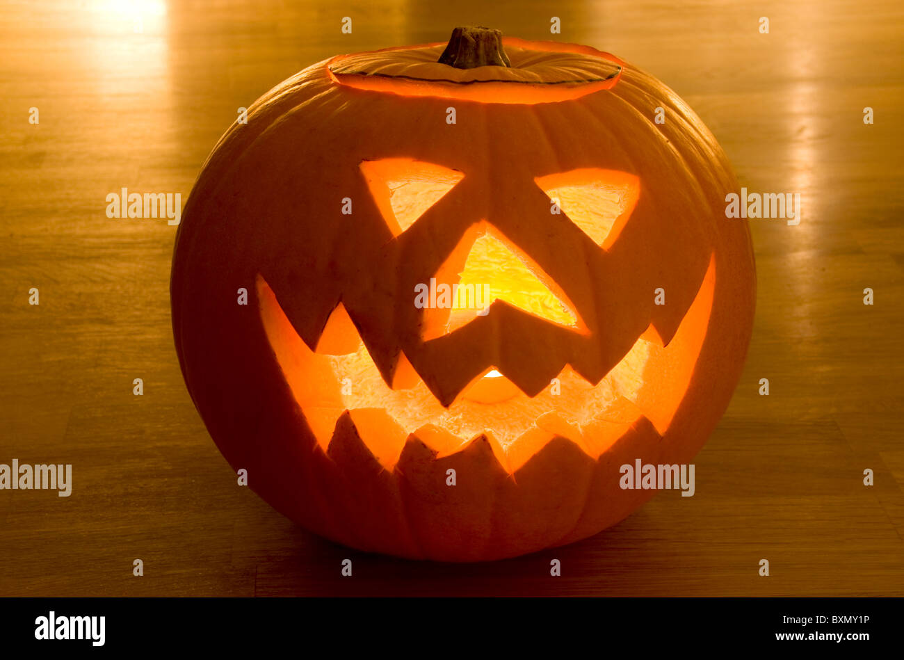 Halloween Pumpkin Head on Wooden Floor Stock Photo