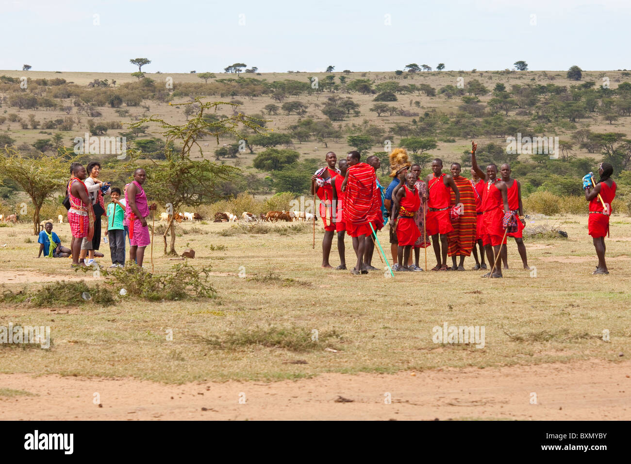 Tourtists visiting a Maasai village on the Masai Mara, Kenya Stock Photo