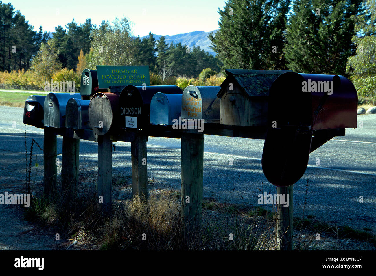 Row of traditional letter boxes on the roadside Stock Photo - Alamy