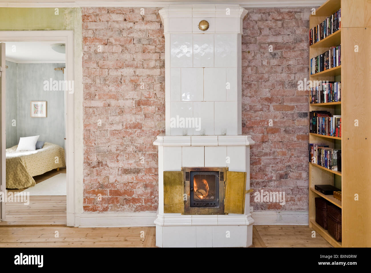 COSY decorating letters against a rustic brick wall above a wood burning  stove Stock Photo - Alamy