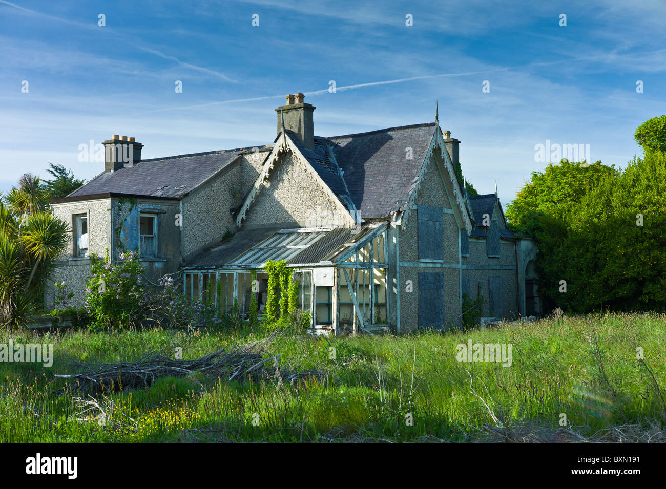 Abandoned derelict detached house awaiting renovation on Ocean Drive, Rosslare, South East Ireland Stock Photo