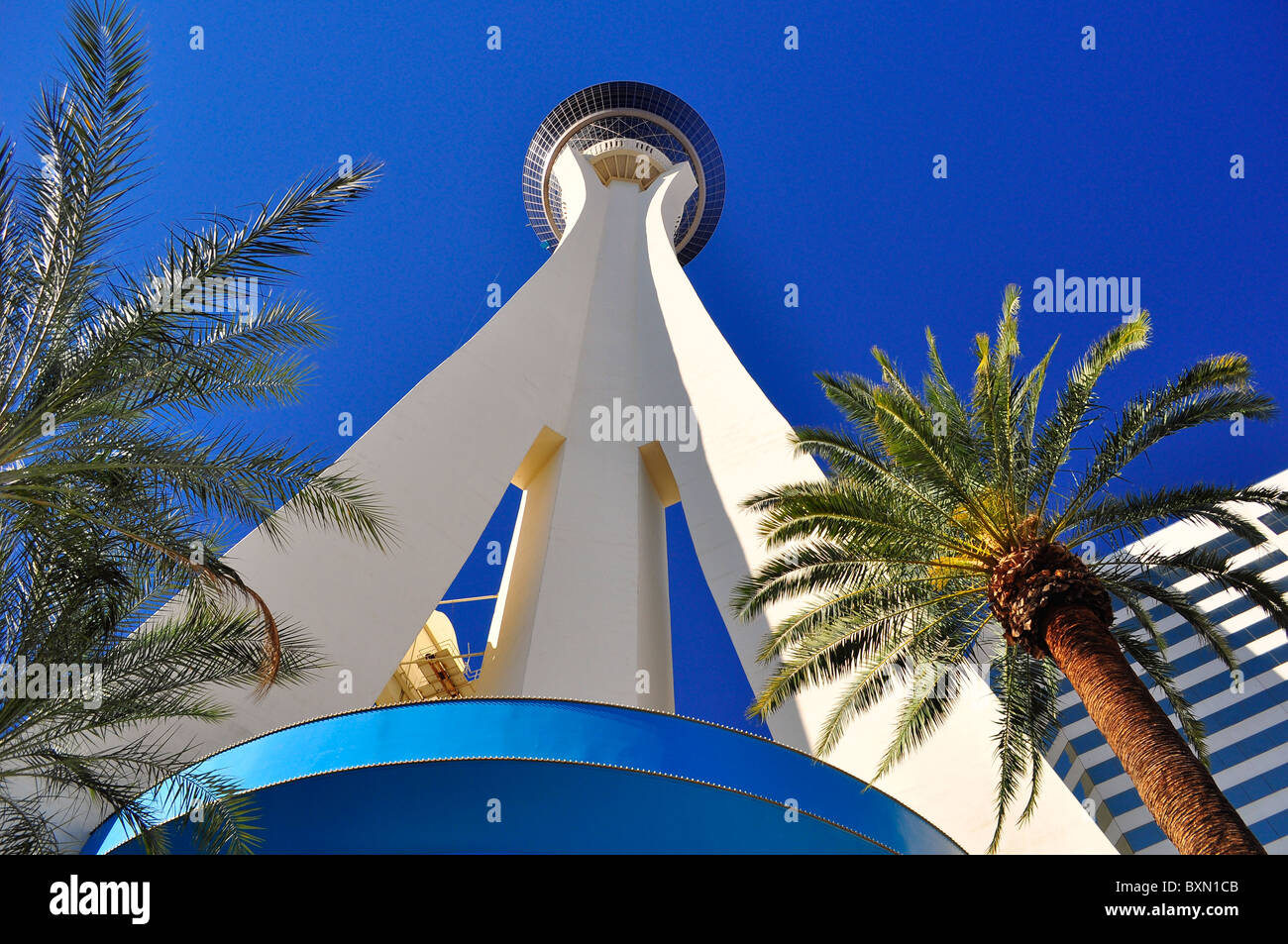 View at the top of the Stratosphere Hotel in Las Vegas, Nevada. The very  top of the tower, the 'Big Shot' ride, is pictured against a blue cloudy  sky. Copy space on