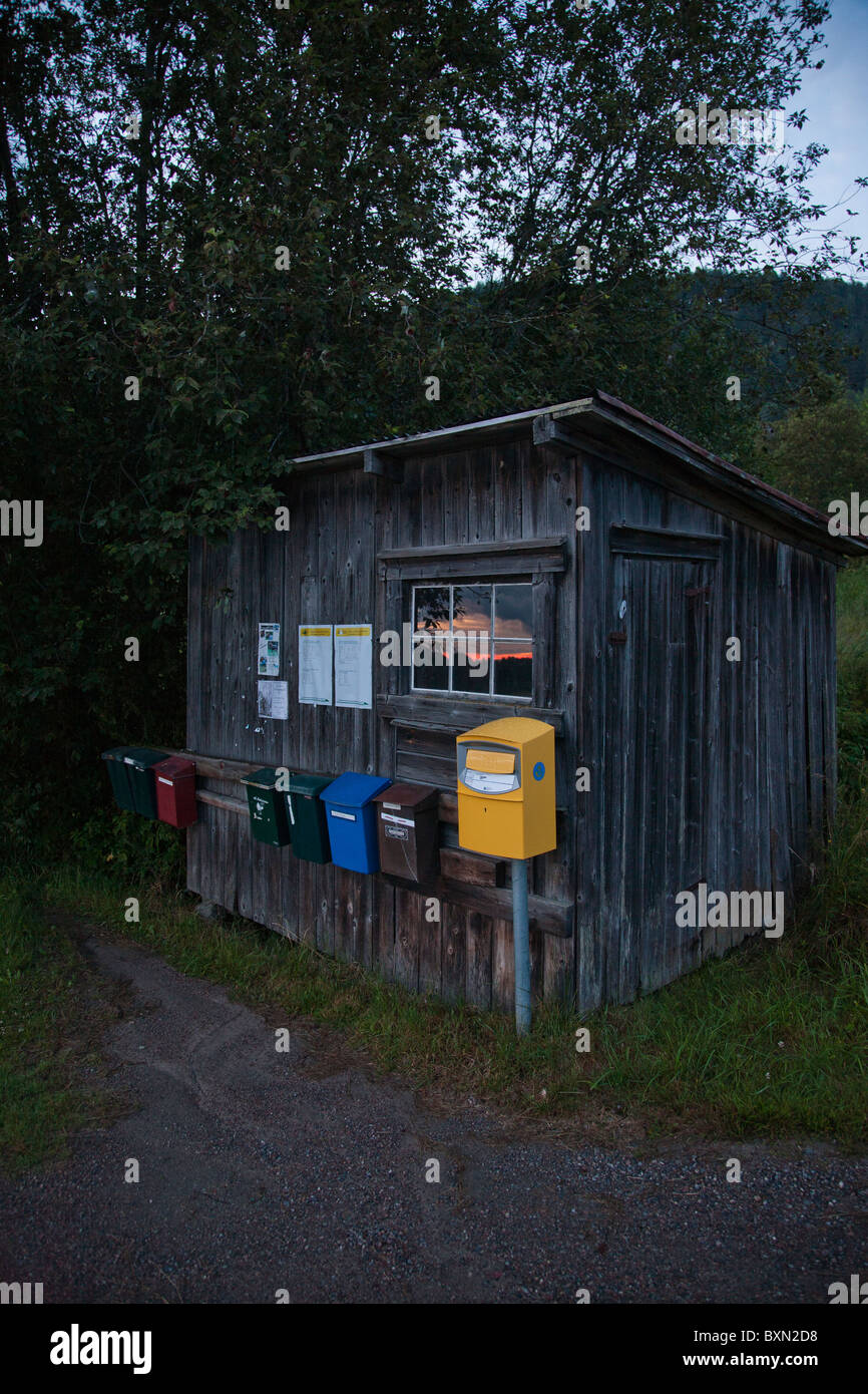 Shed with letter boxes and post box on a summer night in Varmland ...