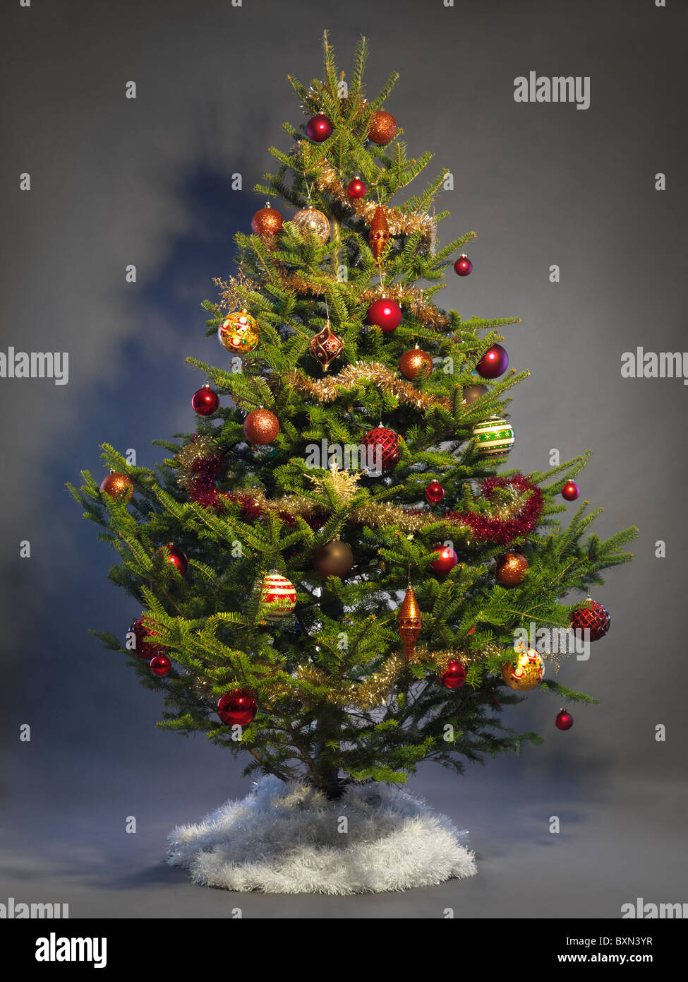 Decorated Christmas tree isolated on studio background Stock Photo - Alamy