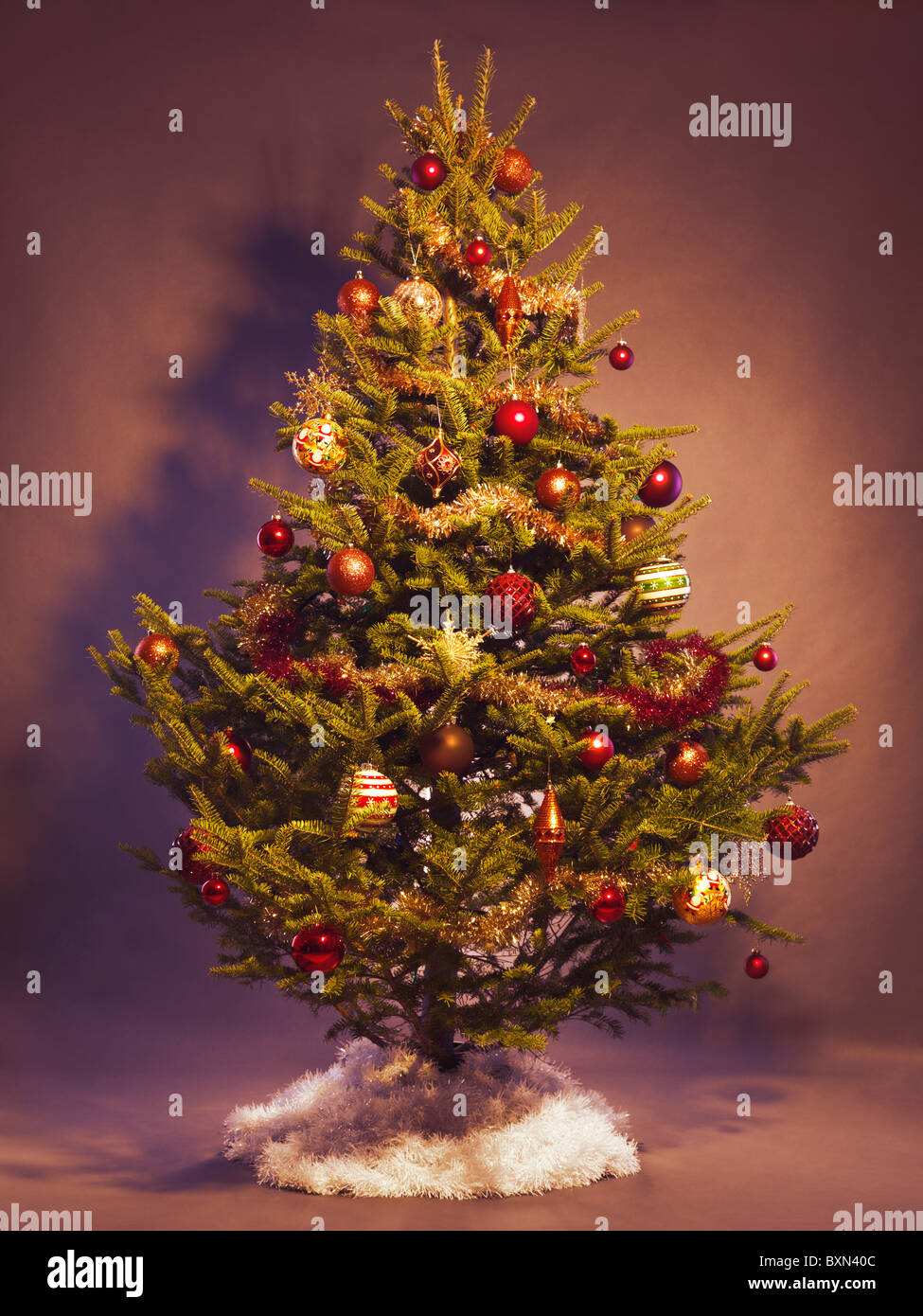 Decorated Christmas tree isolated on studio background Stock Photo - Alamy