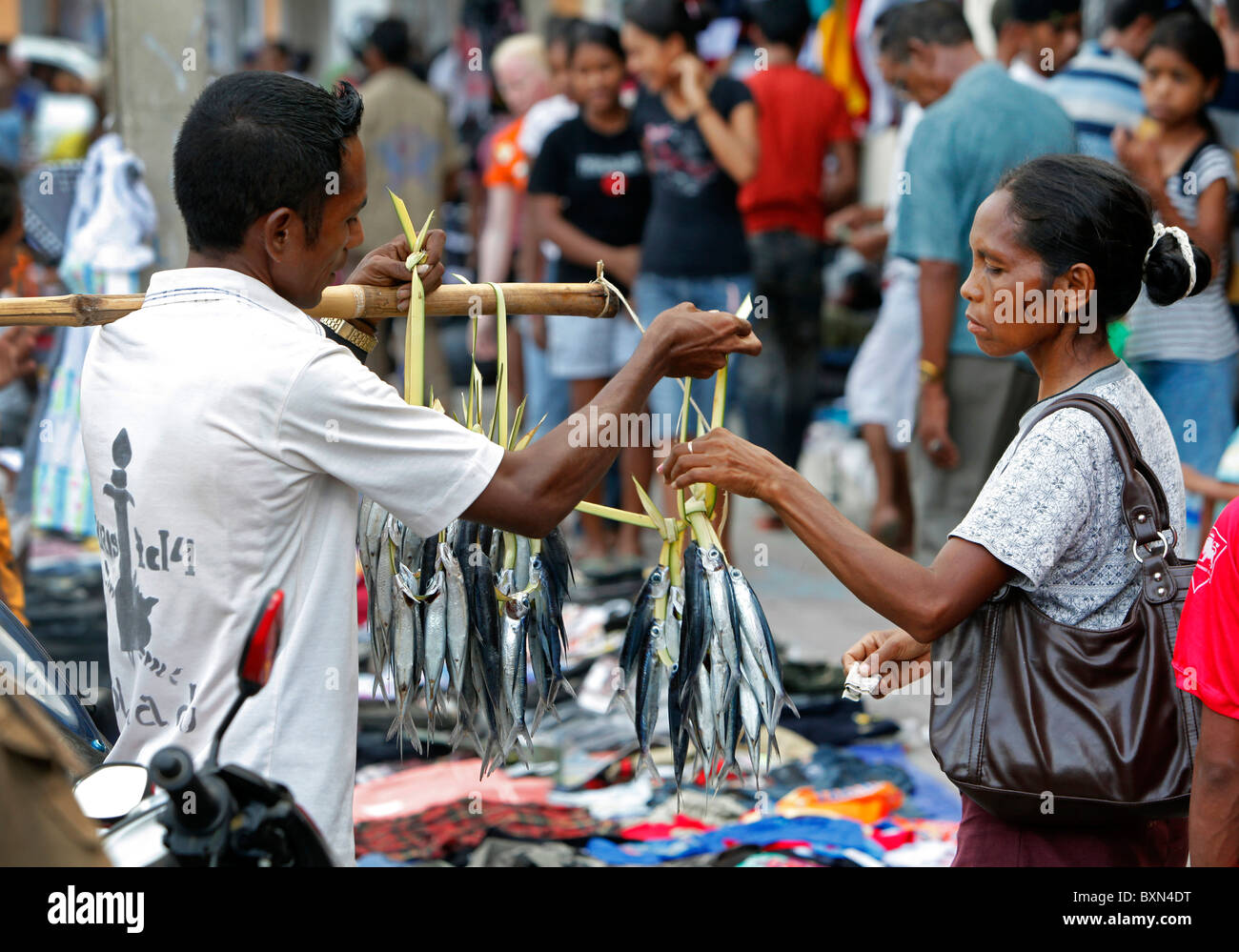Trader selling fish, Colmera commercial district of Dili capital of Timor Leste (East Timor) Stock Photo