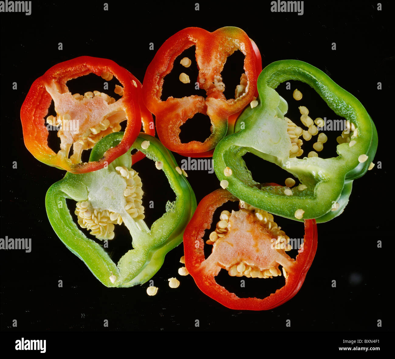 SLICED RED AND GREEN SWEET PEPPERS / STUDIO Stock Photo - Alamy