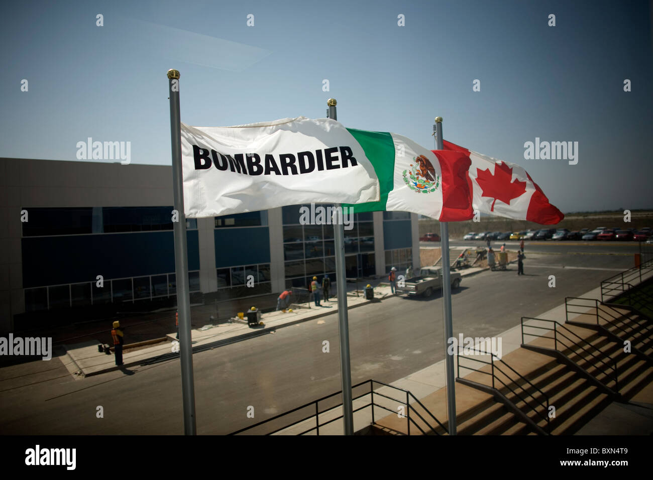The Mexican flag and the canadian flag decorate a Bombardier Aerospace
