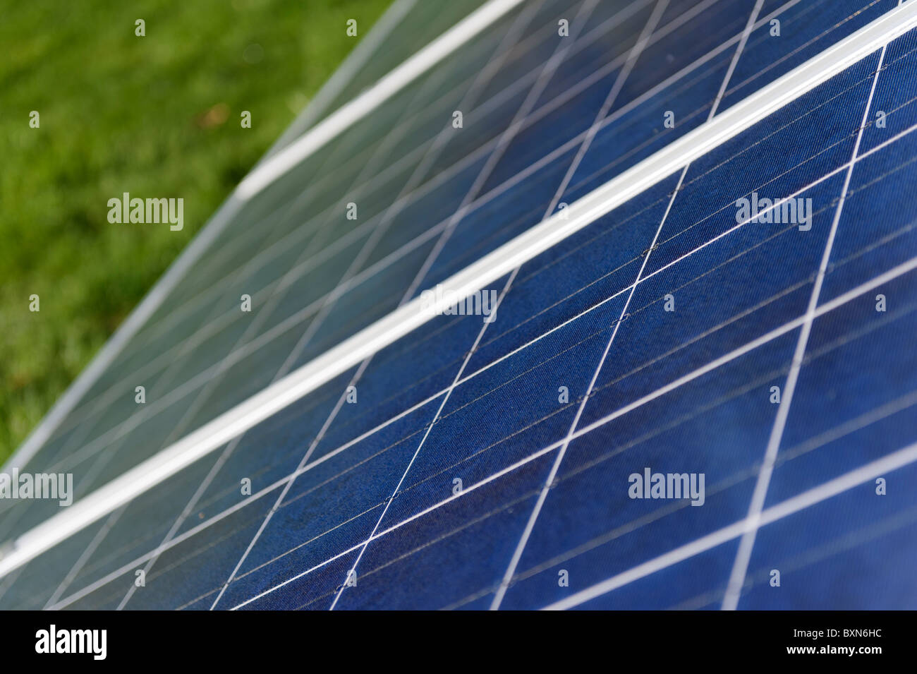 Detail of photo-voltaic solar panels in an array in the UK Stock Photo ...