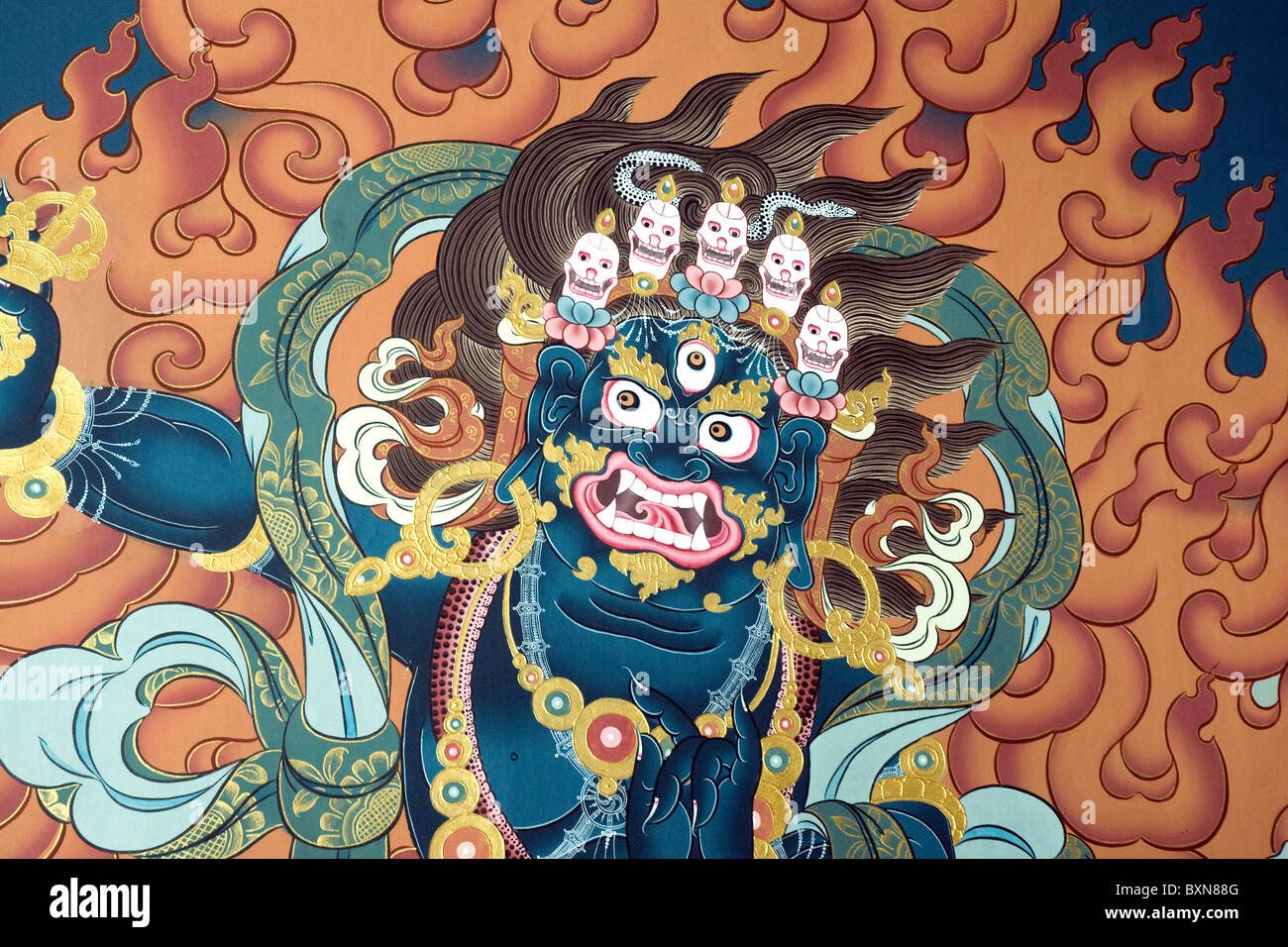Painted on an inner wall of the Thimpu dzong: Channa Dorji, Buddhist god of power, capped by five skulls, the 'five negatives' Stock Photo