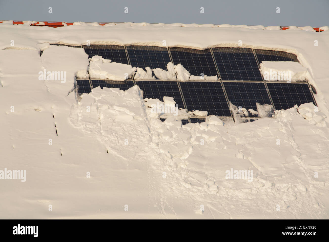 snow covered solar panels on a roof Stock Photo Alamy