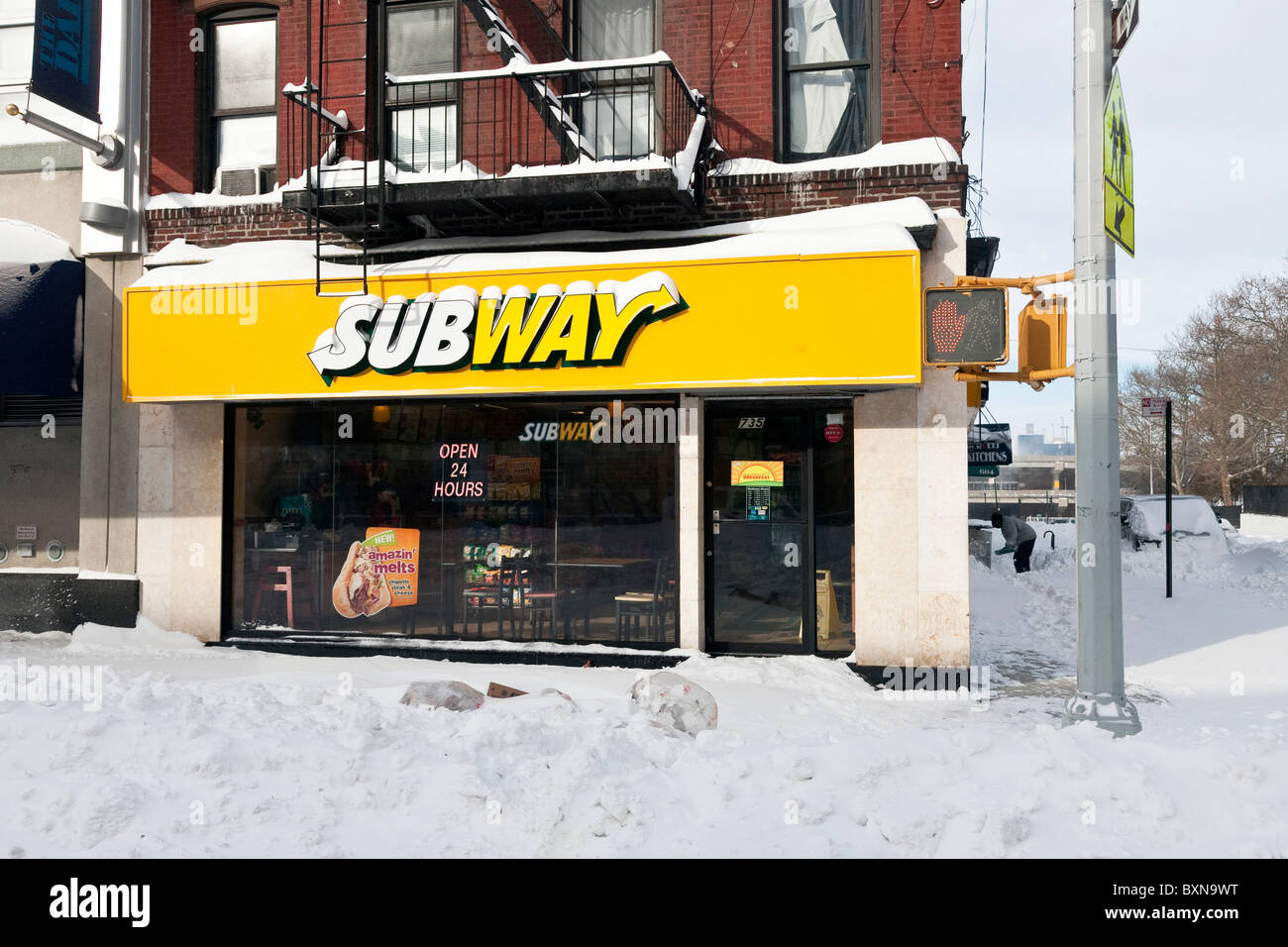 24 hour Subway fast food restaurant is open on Eleventh Avenue West side Manhattan the morning after blizzard in New York City Stock Photo