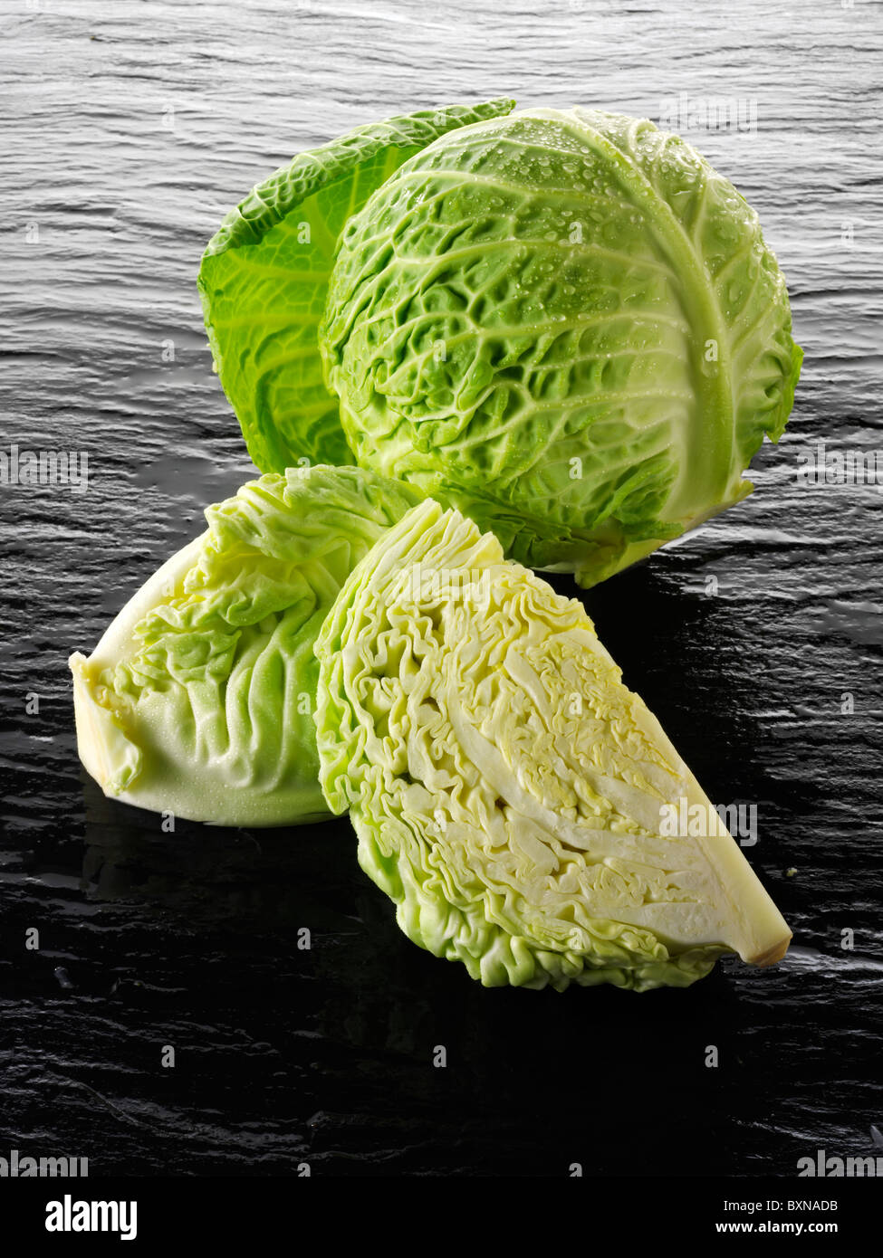 Whole and cut Savoy cabbage Stock Photo Alamy