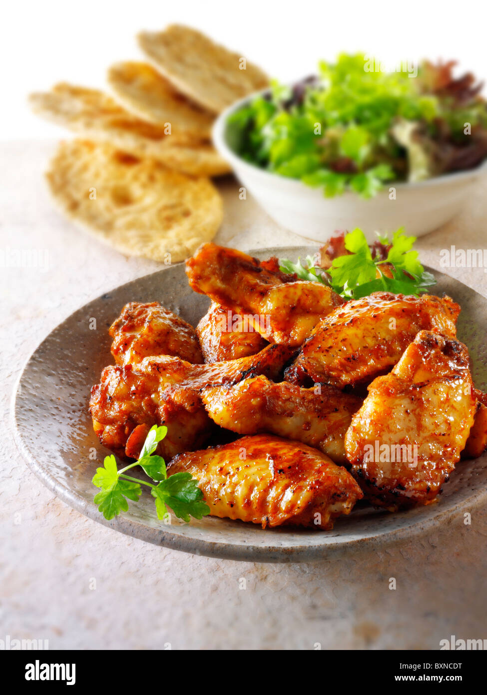 Barbecue chicken wings with salad Stock Photo