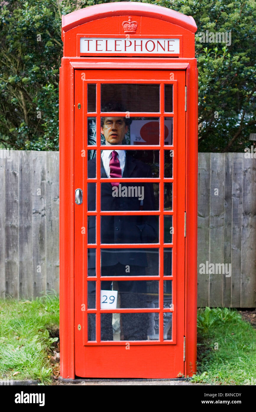 Gordon Brown Scarecrow in a red telephone box Stock Photo