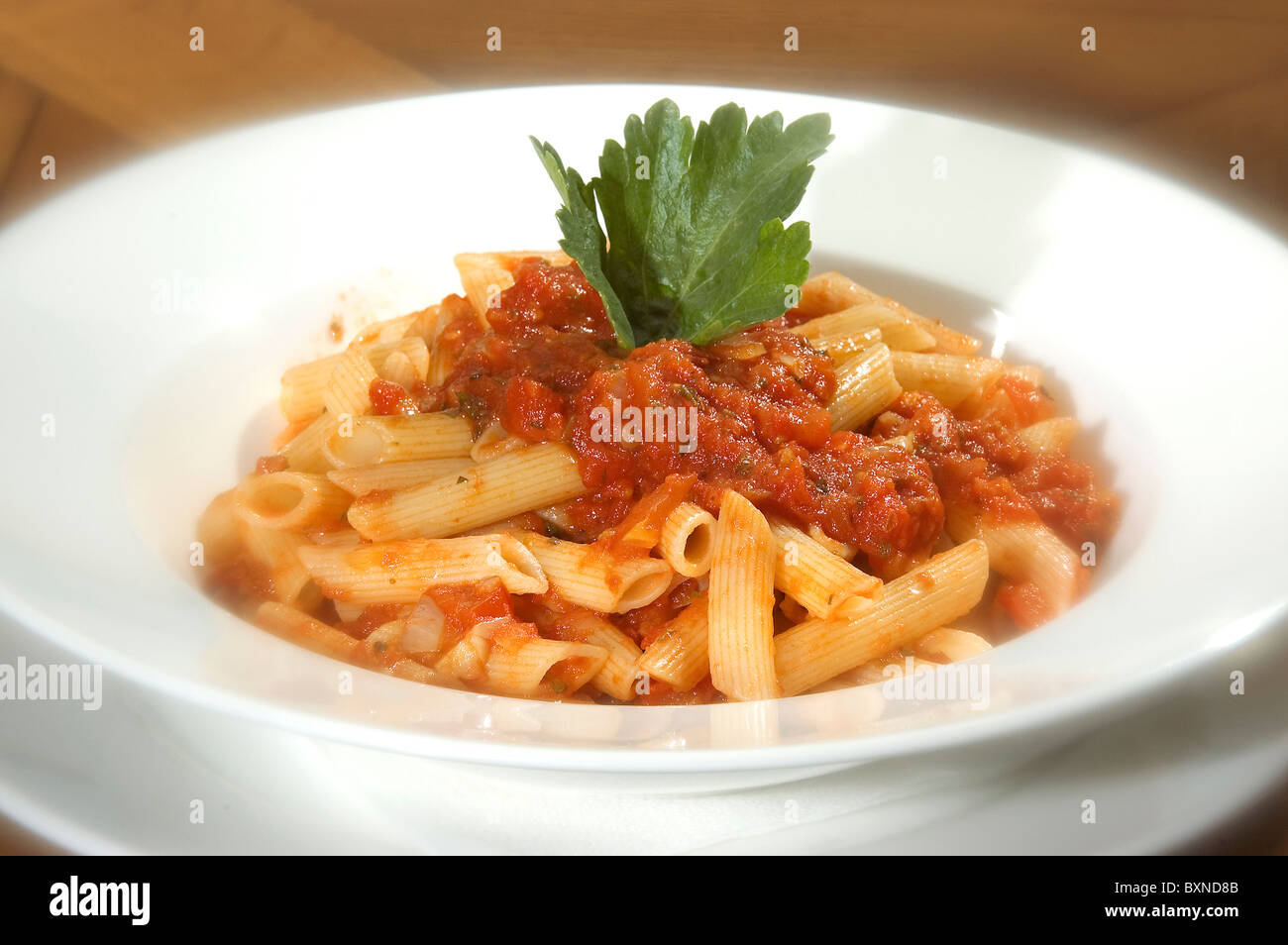 Macaroni Napolitana w tomato sauce and parsley Stock Photo
