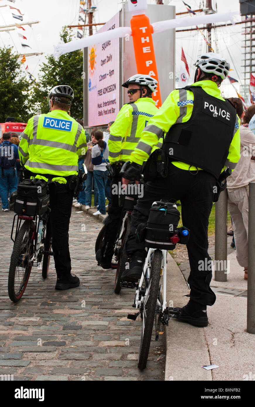 Three PSNI officers on bicycles Stock Photo