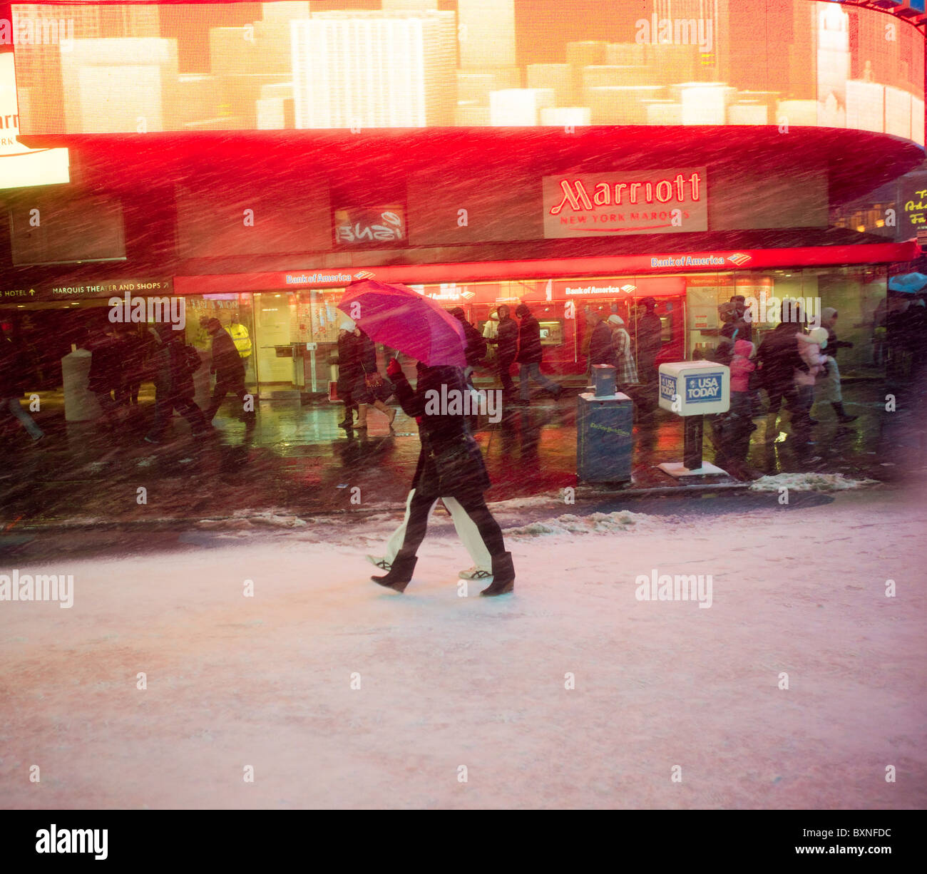 New Yorkers and visitors maneuver through the snow in Times Square in New York Stock Photo Alamy