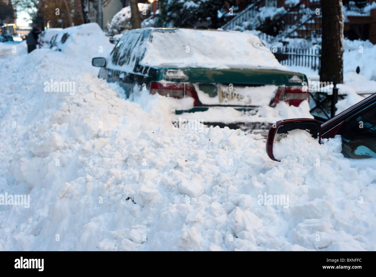 Buried cars out of the snow in the Chelsea neighborhood of New York Stock Photo