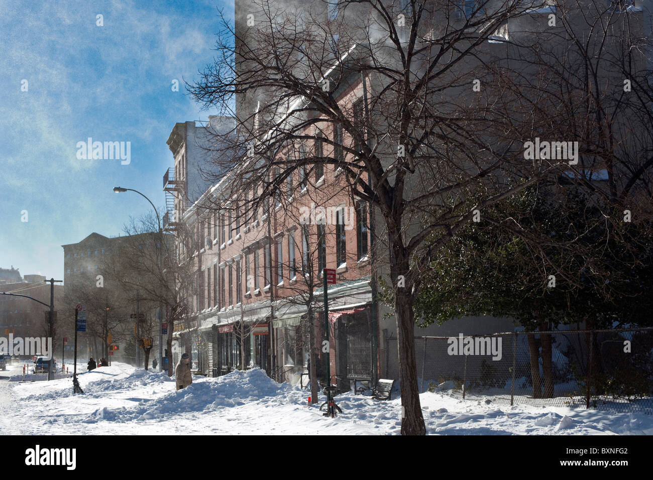 Snow blows off of buildings in the Greenwich Village neighborhood of New York Stock Photo