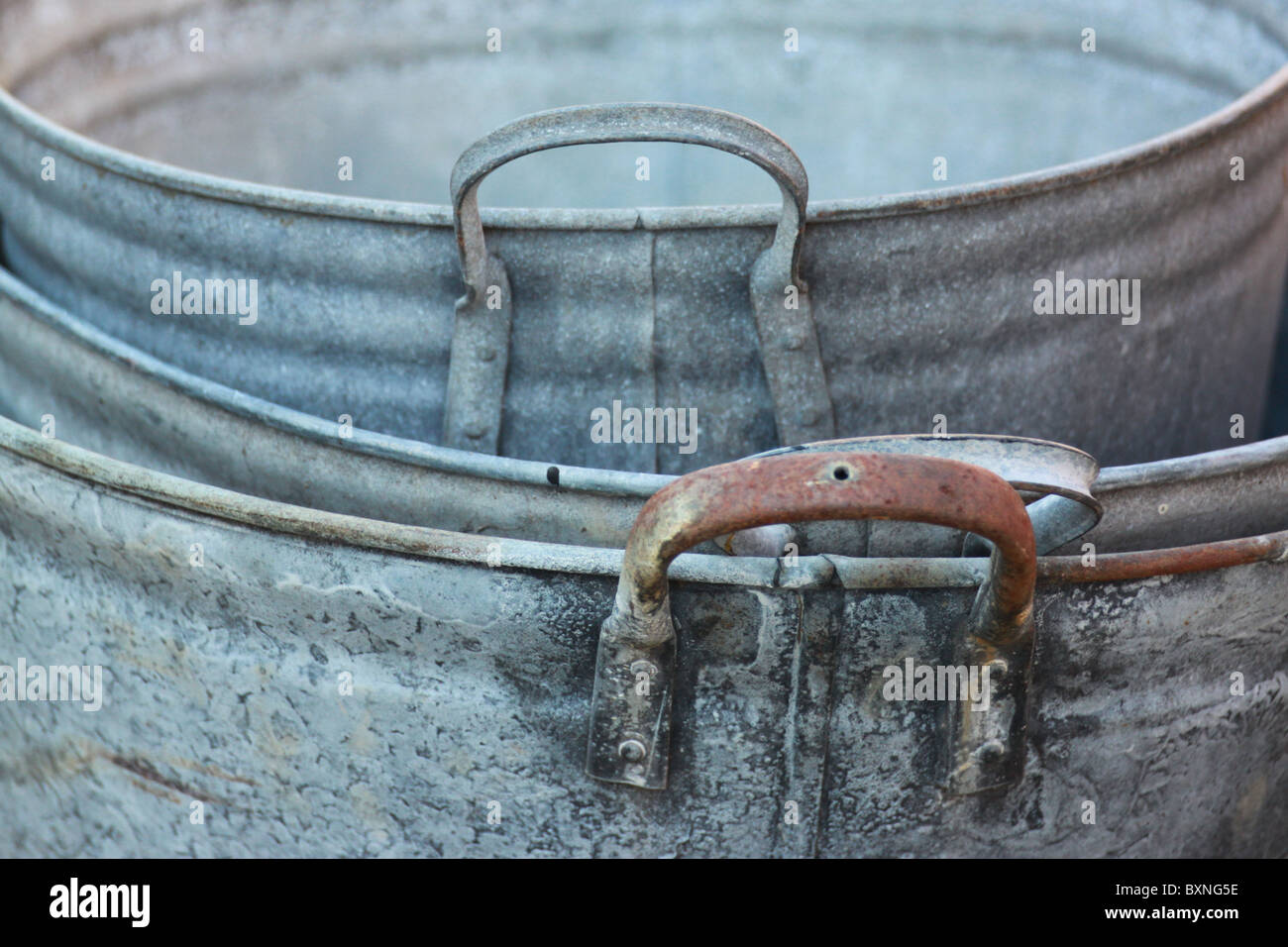 old metal tubs,zinc with rusty iron handles Stock Photo Alamy