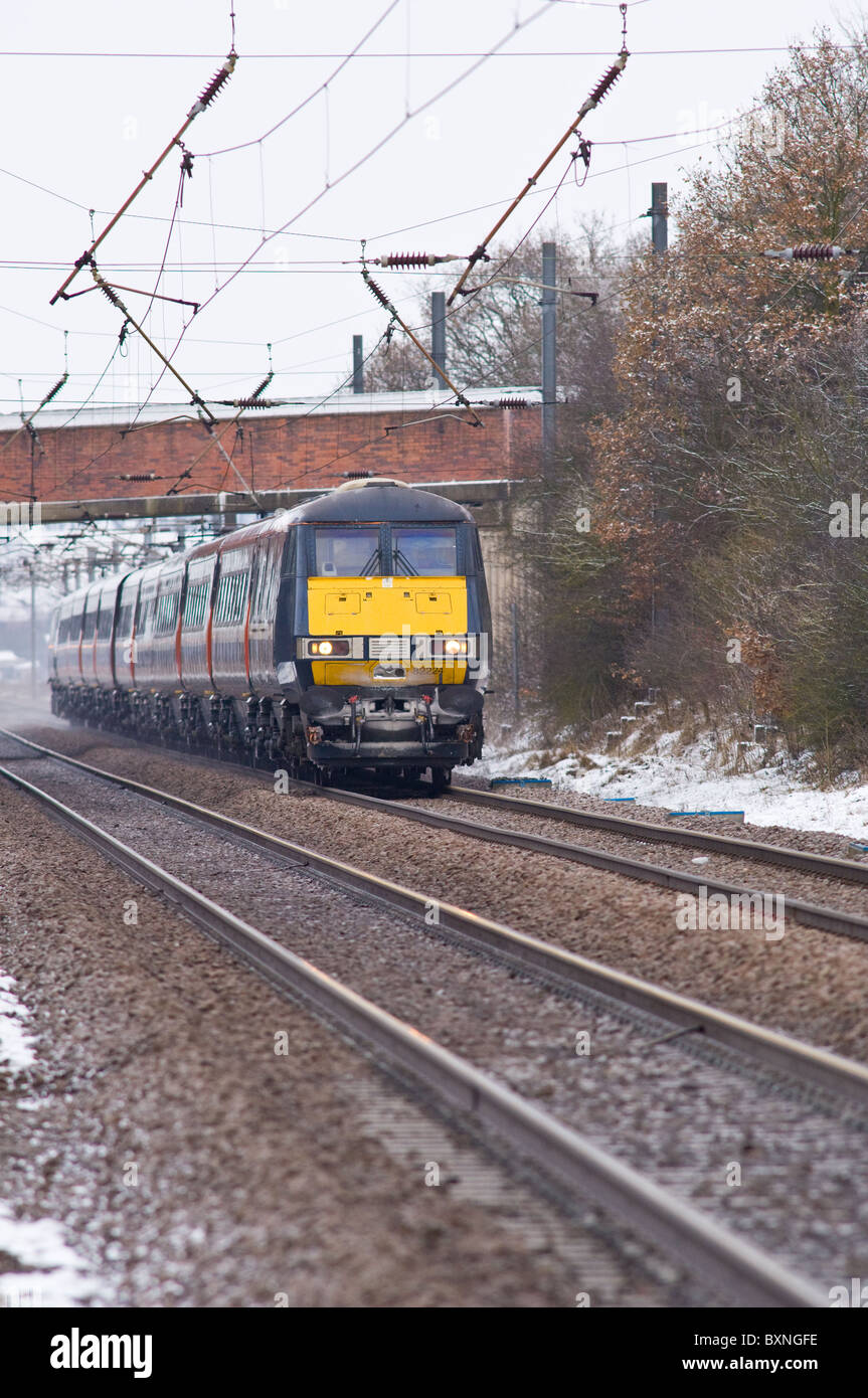 The Intercity 225 high speed train on the east coast main line with fresh snow on the tracks Stock Photo