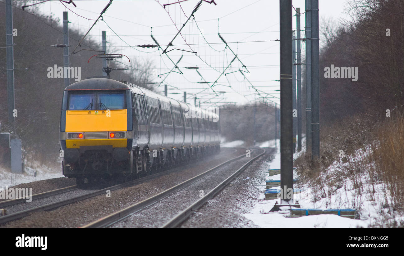 The Intercity 225 high speed train on the east coast main line with fresh snow on the tracks Stock Photo