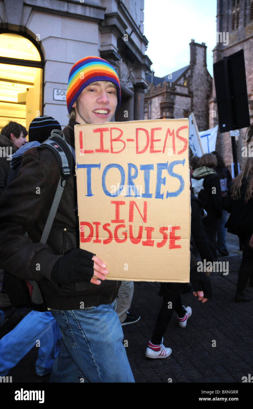 Protester with Lib-Dems Tories in disguise placard, UK Stock Photo