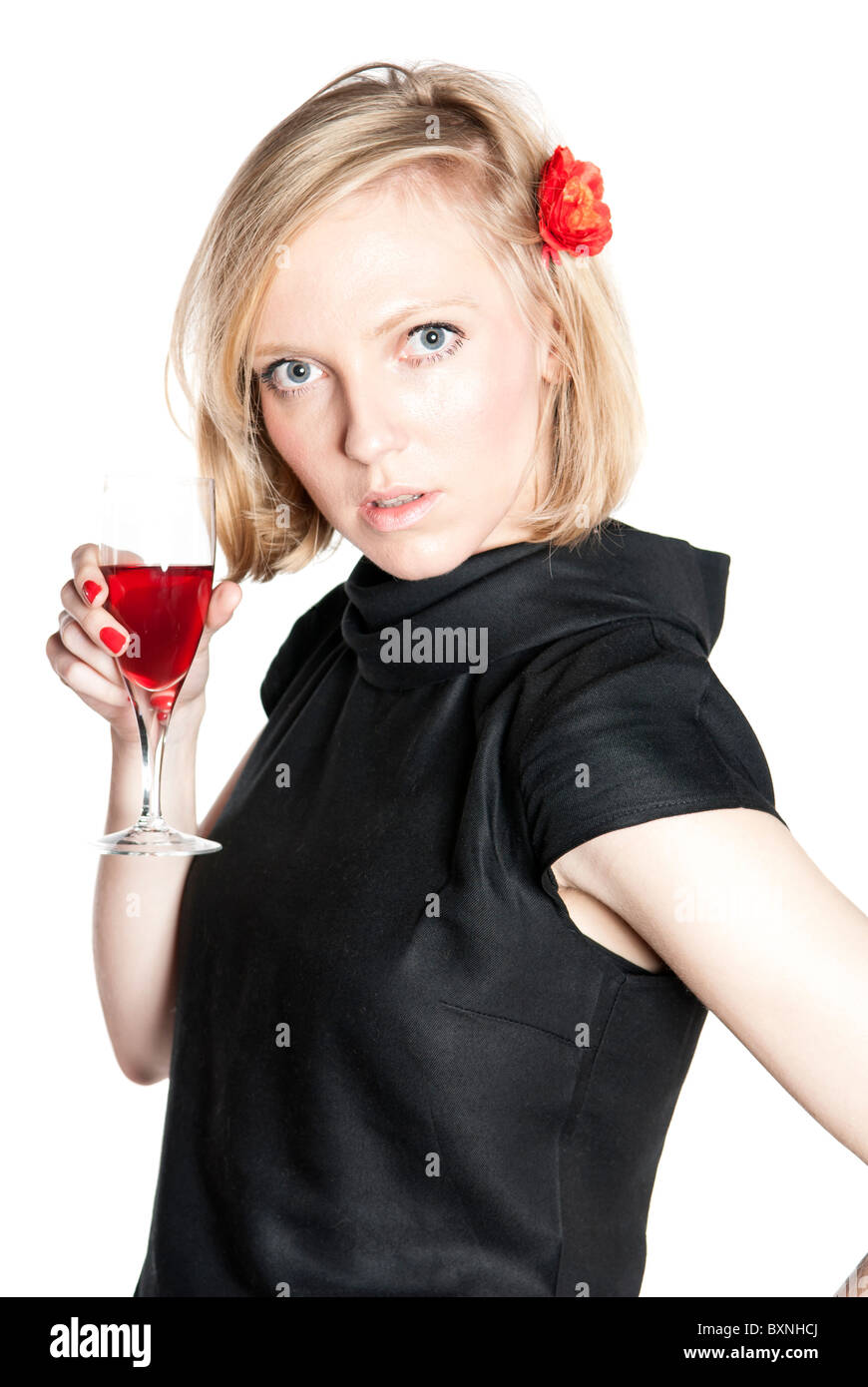 Young attractive woman in black dress holding a glass of red wine ...