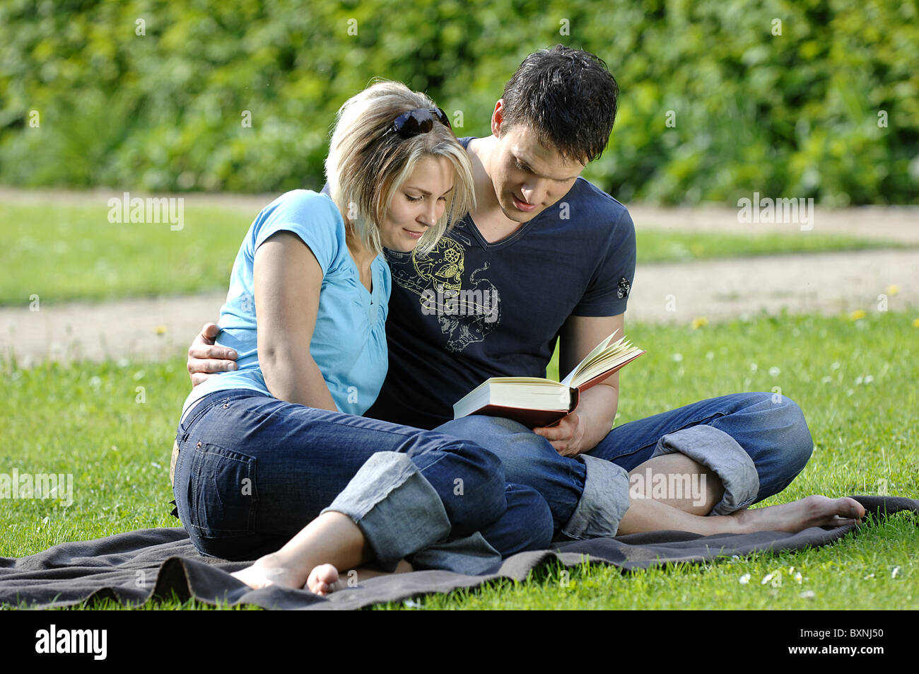 Couple reading a book Stock Photo