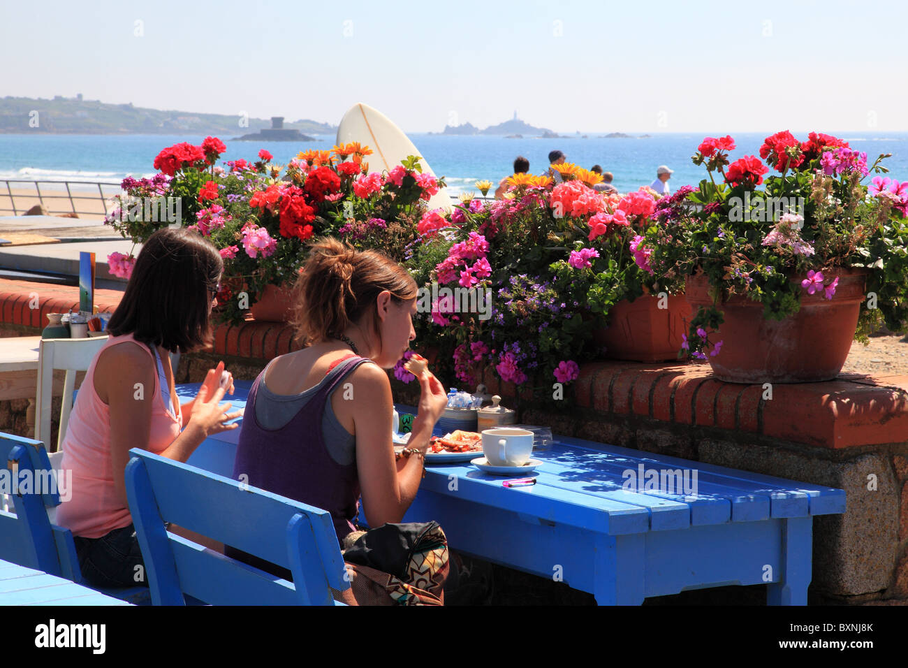 Jersey Island Discovery Bay Girls eating lunch among flowers Channel