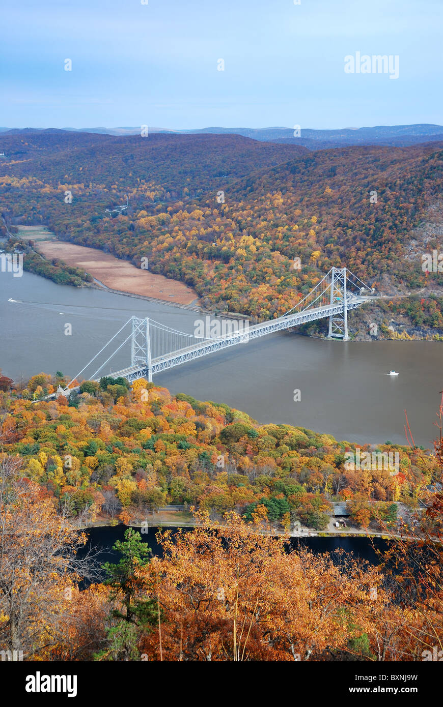 Bear Mountain bridge aerial view in Autumn with colorful trees in forest over Hudson River in New York State. Stock Photo