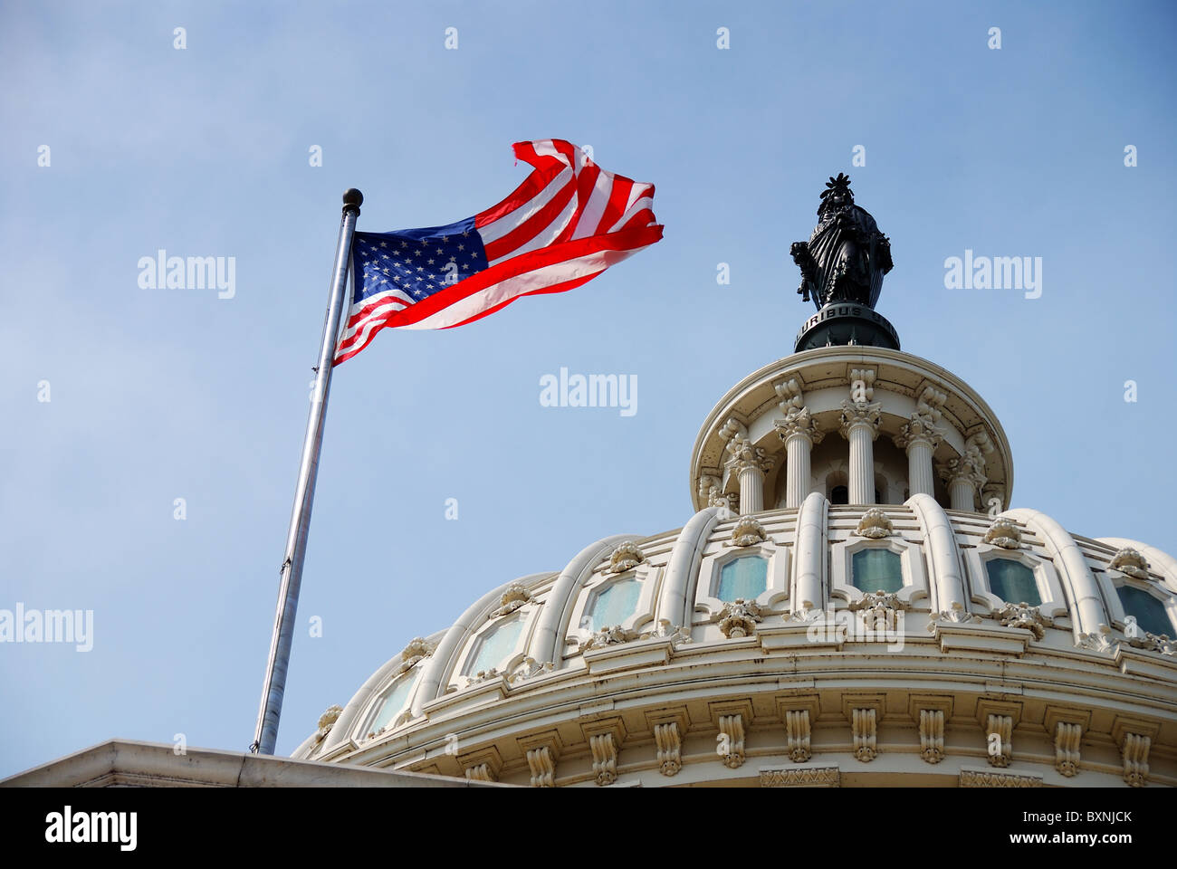 US national flag flying over Capitol Hill Building in Washington DC Stock Photo