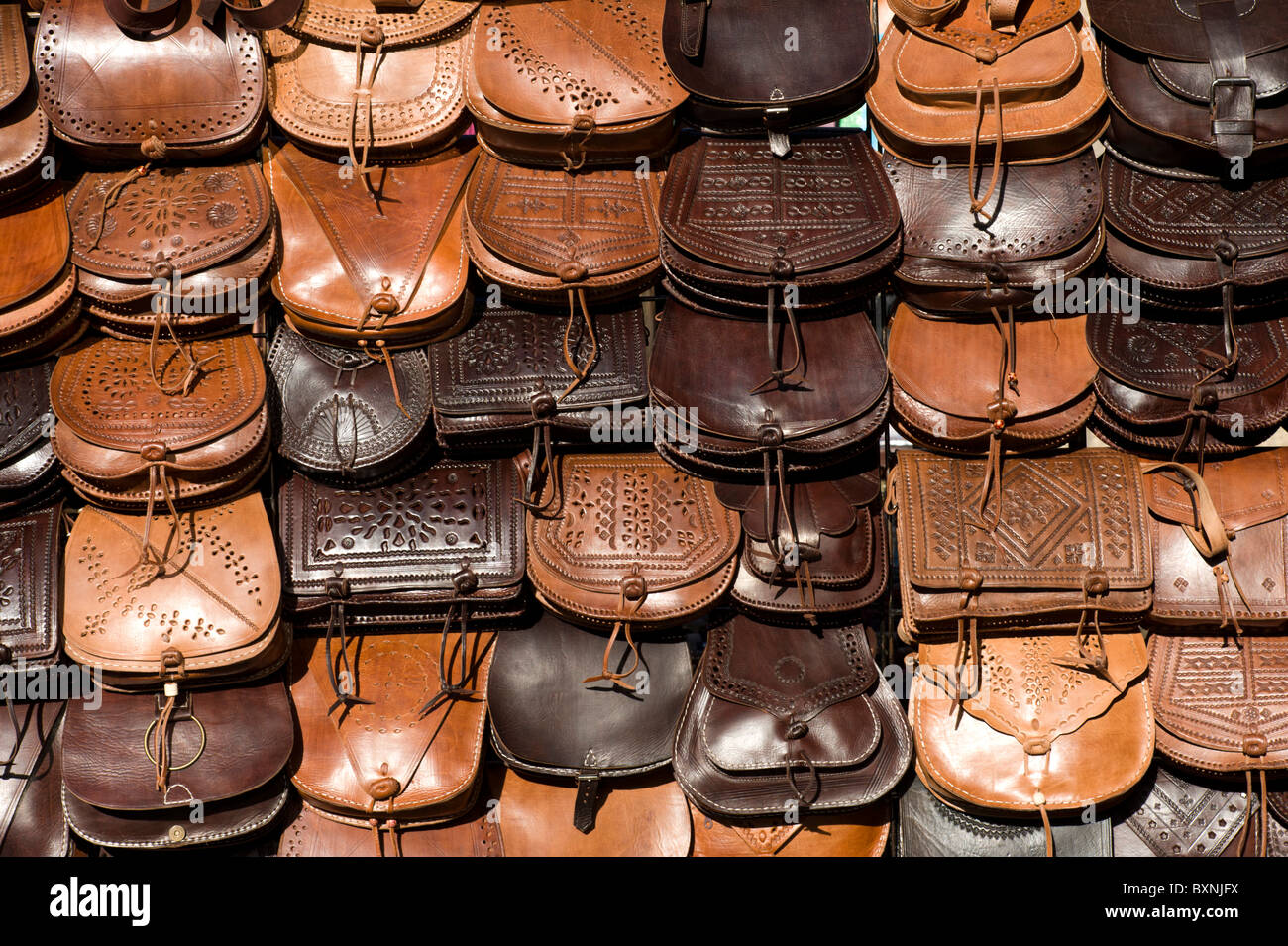 Handmade leather bags on market stall, Spain Stock Photo
