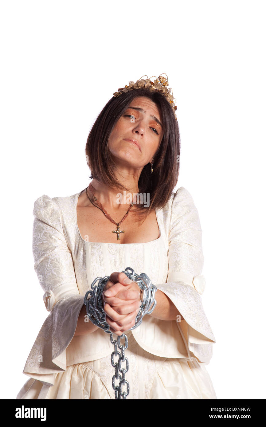 sad bride trapped into marriage with chains (isolated on white) Stock Photo