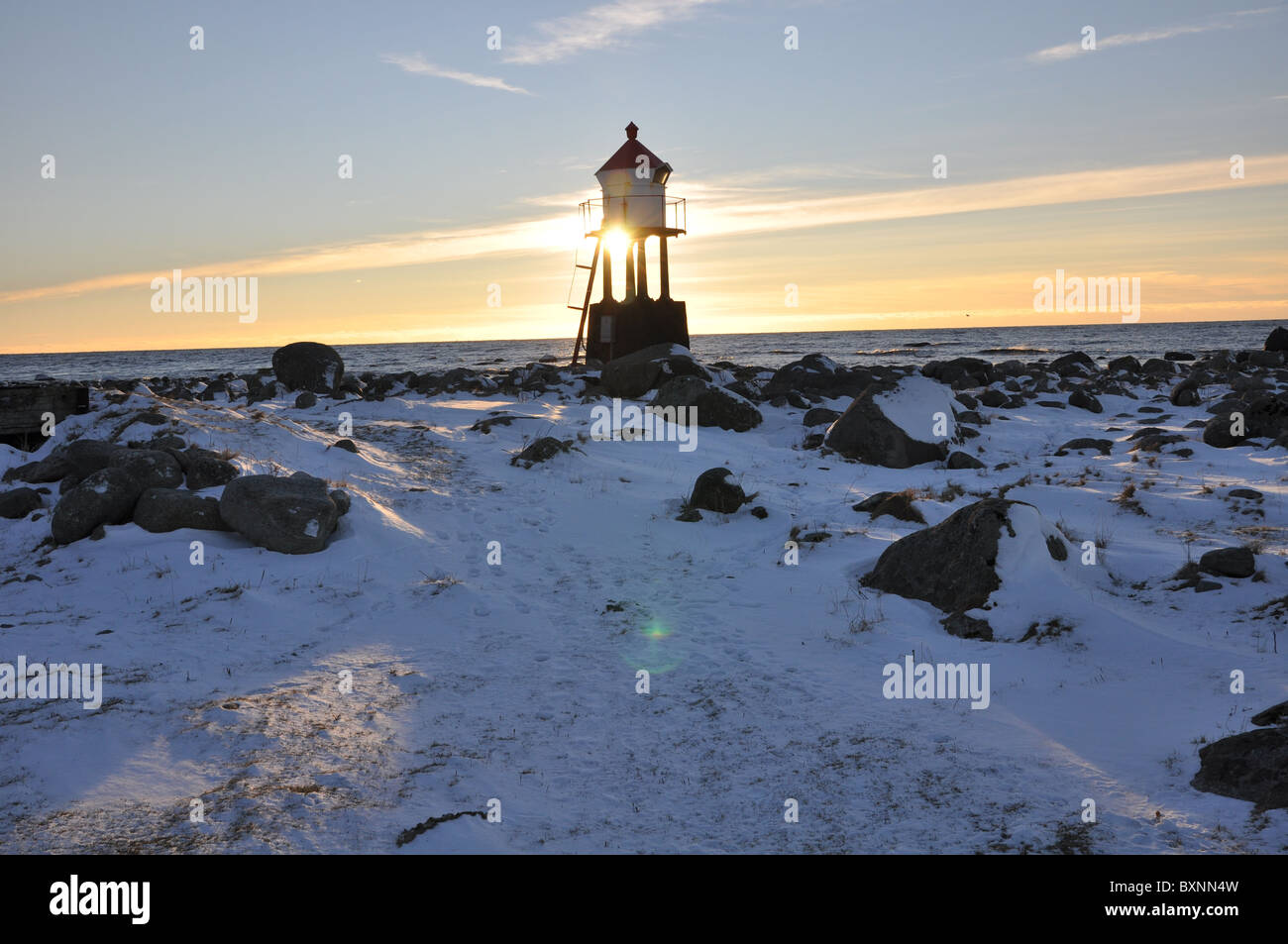 Lighthouse lamp and clear cold winter weather, snow, winter, blue sky Stock Photo