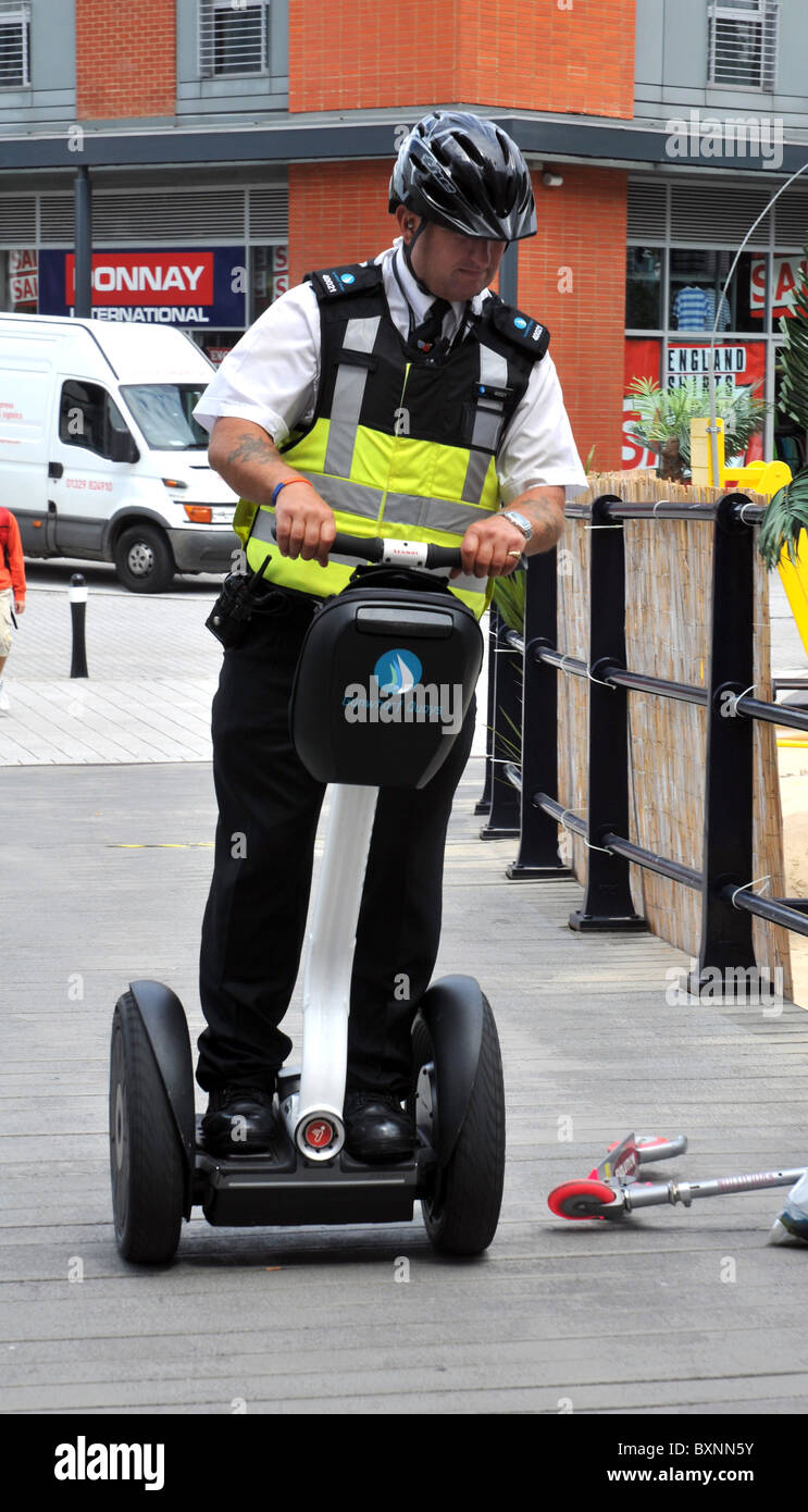 Security officer on patrol, Gun Wharf Quays, Portsmouth, Hampshire, Britain, UK Stock Photo