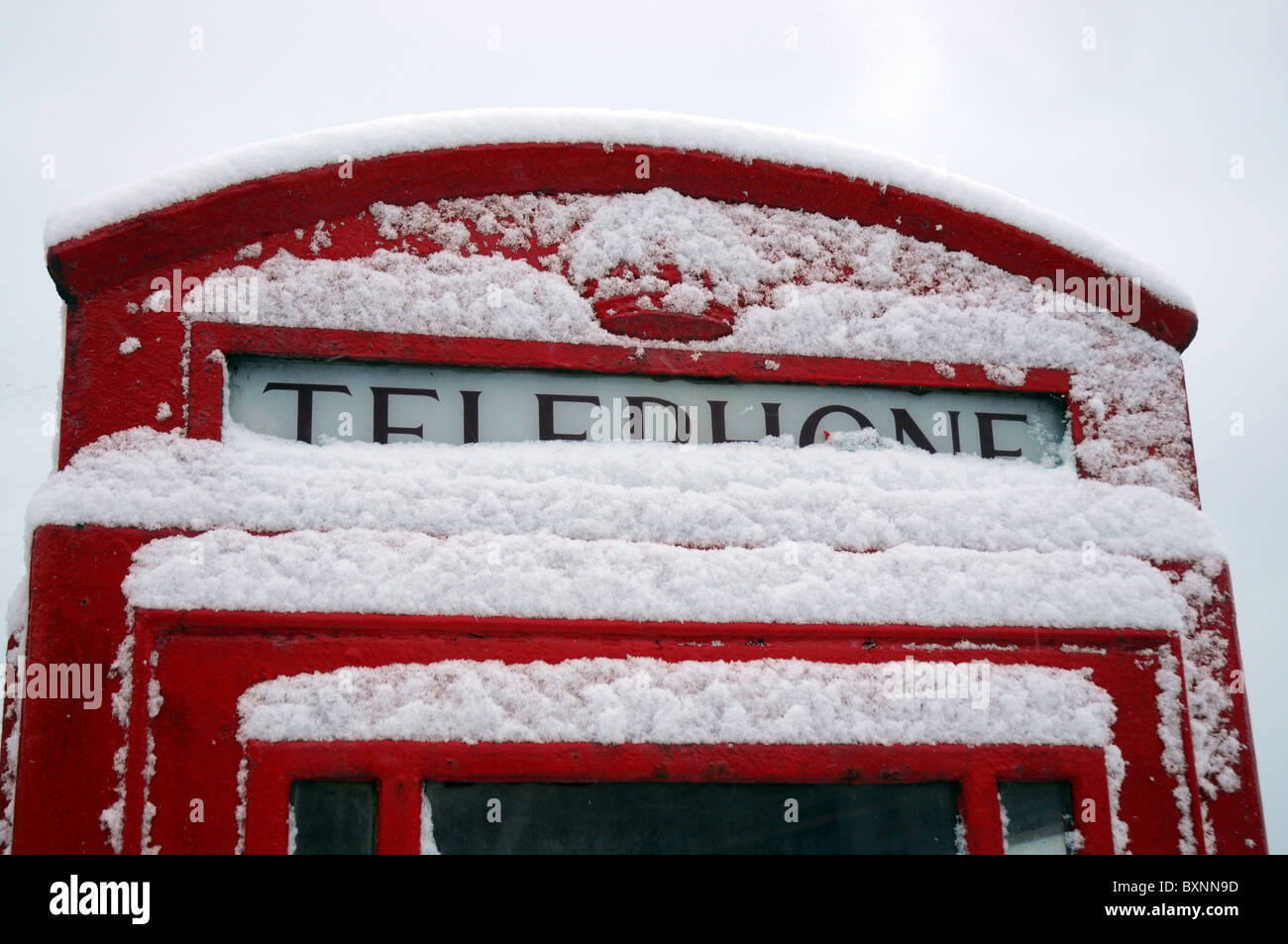 Snow on a  telephone box, UK Stock Photo