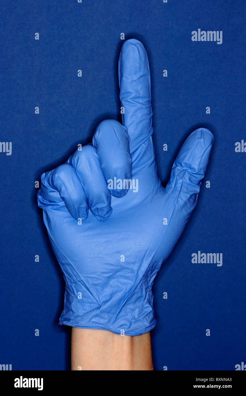 Hand wearing a blue glove Stock Photo