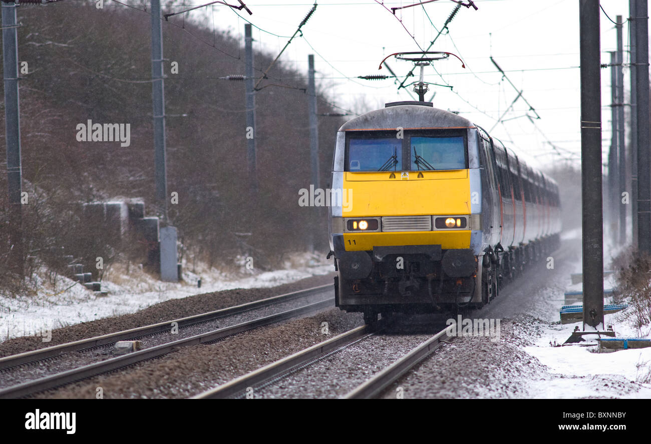 The Intercity 225 high speed train on the east coast main line with fresh snow on the tracks Stock Photo