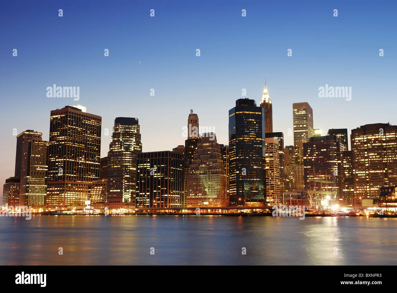New York City Manhattan skyline at dusk over Hudson River with ...