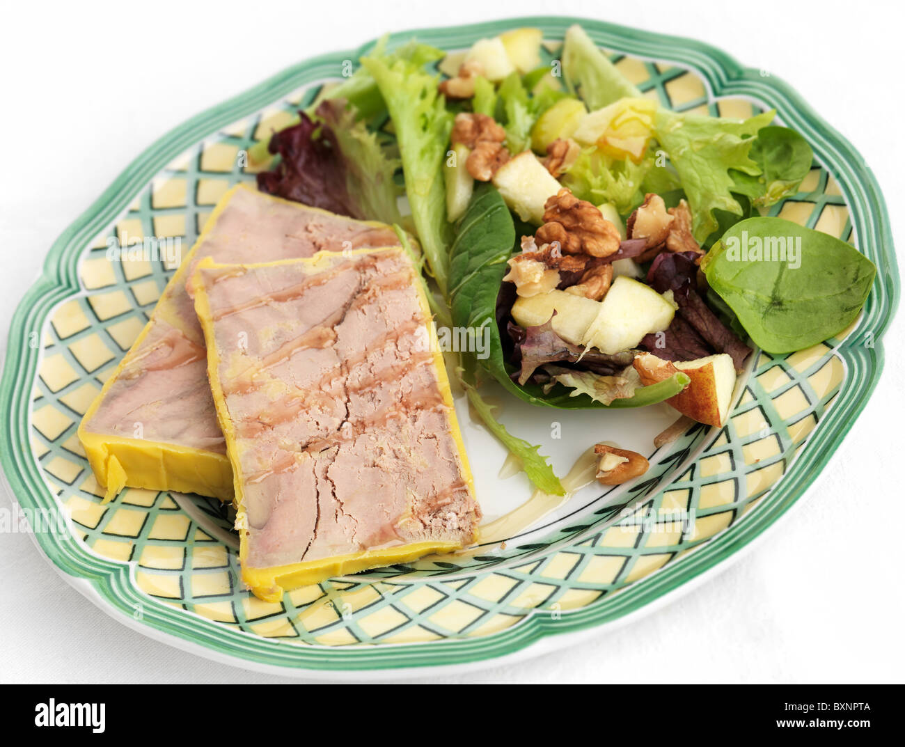 Foie gras with walnut salad and honey dressing Stock Photo